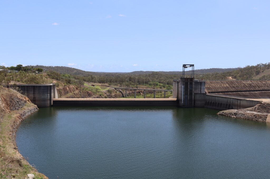 Image of the Awoonga Dam wall, with water in the foreground